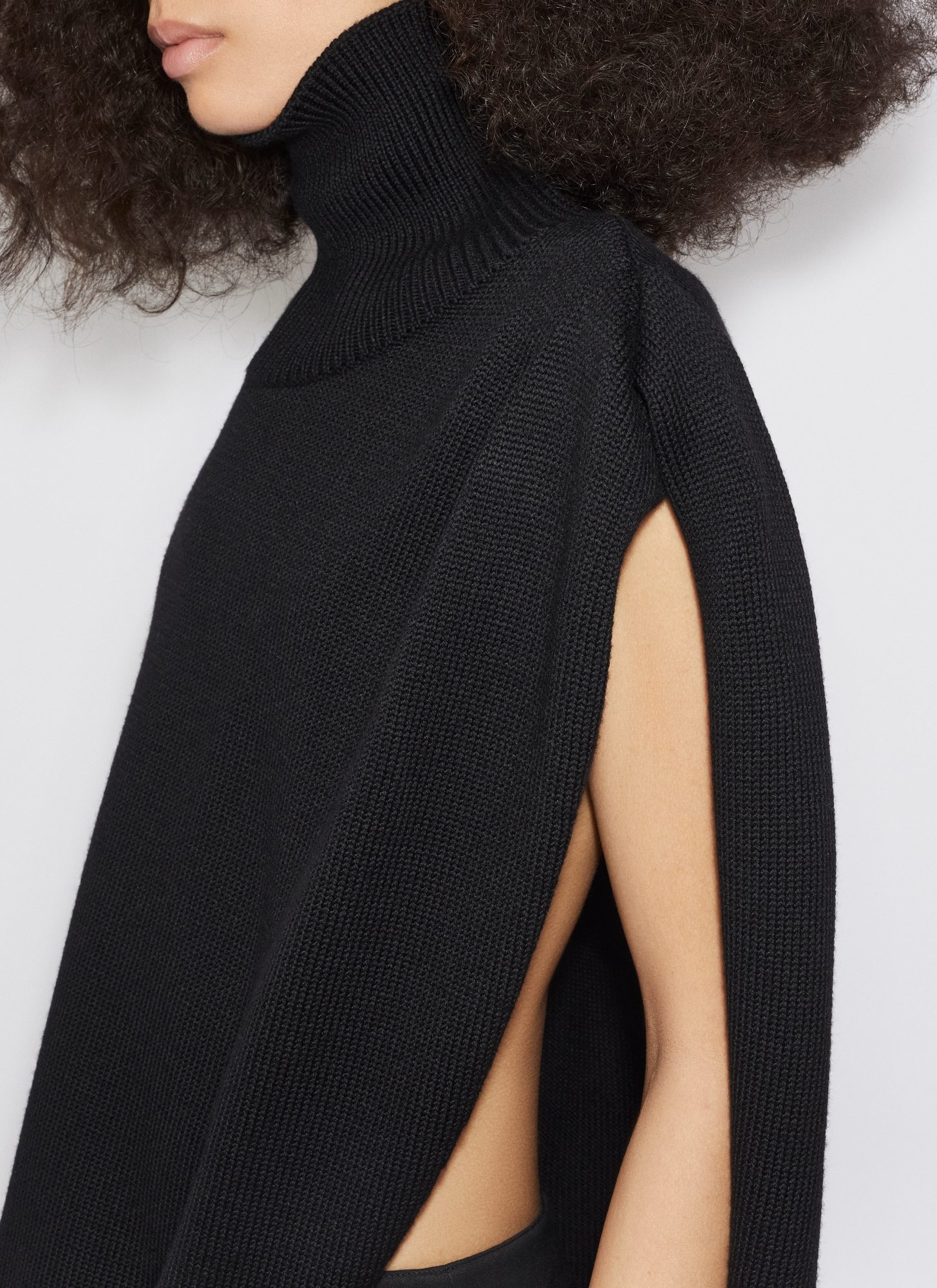 Alaïa Knitted Asymmetrical Cape Pullover In Black