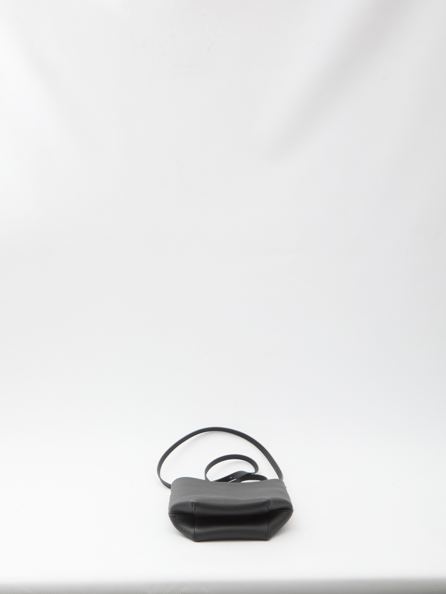 The Row Crossbody Bag Featuring Adjustable Strap In Black