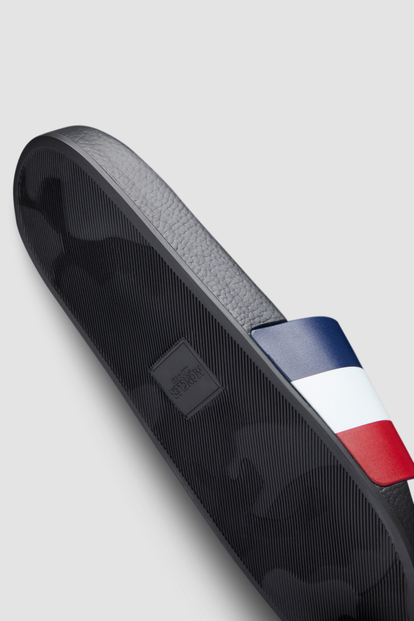 Moncler Basile Logo-embossed Striped Rubber Slides In Multi