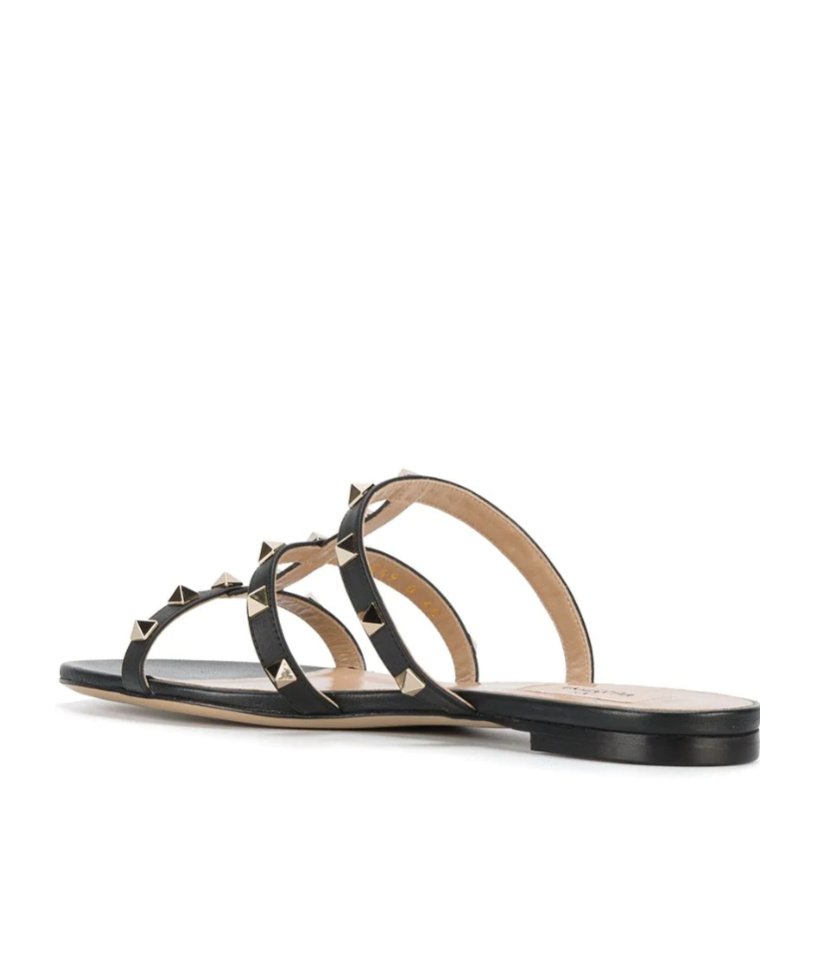 Shop Valentino Rockstud Flat Slide Sandal In Black