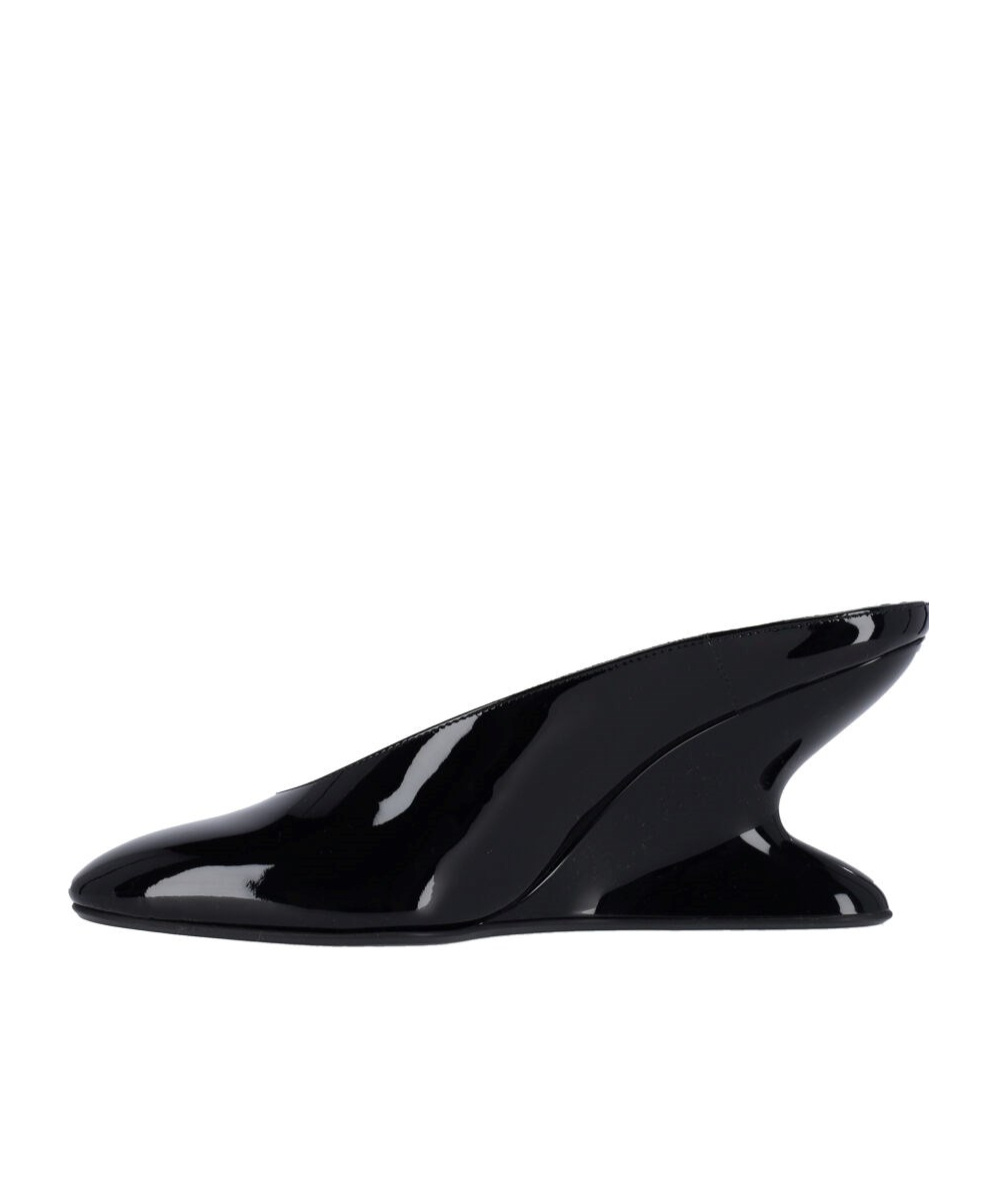 Shop Alaïa Mules With Curved Wedges In Black