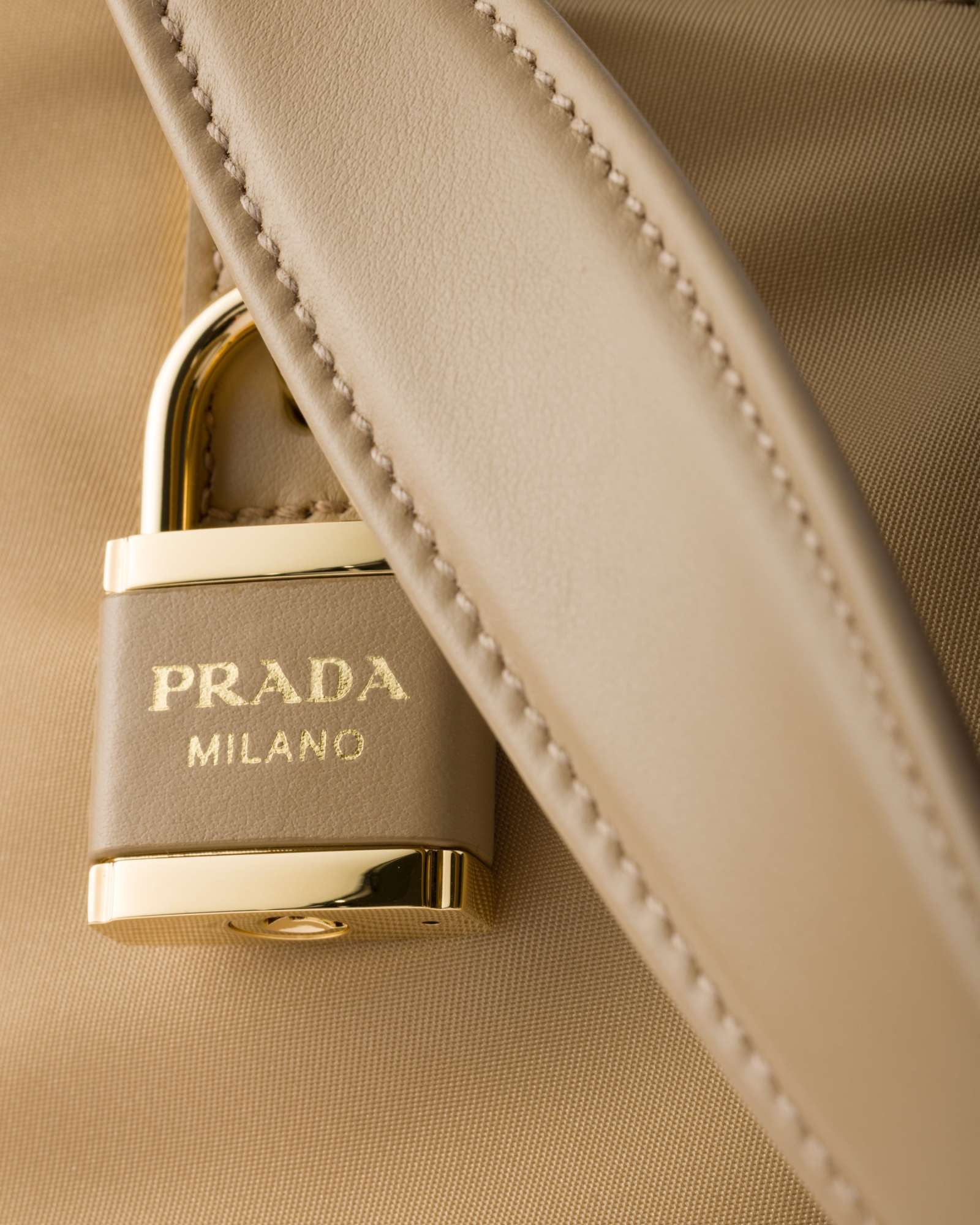 Prada Aimée Large Re-nylon And Leather Shoulder Bag With Padlock In Camel Brown