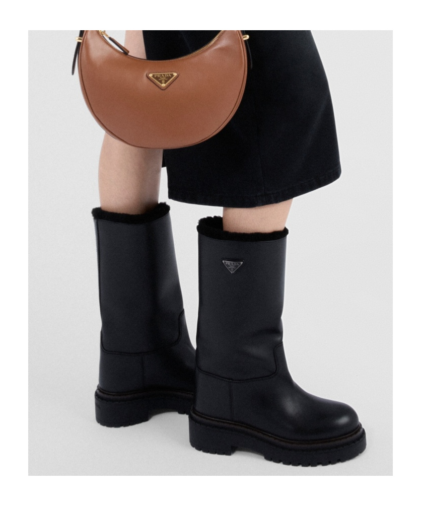 Shop Prada Leather And Shearling Boots In Black