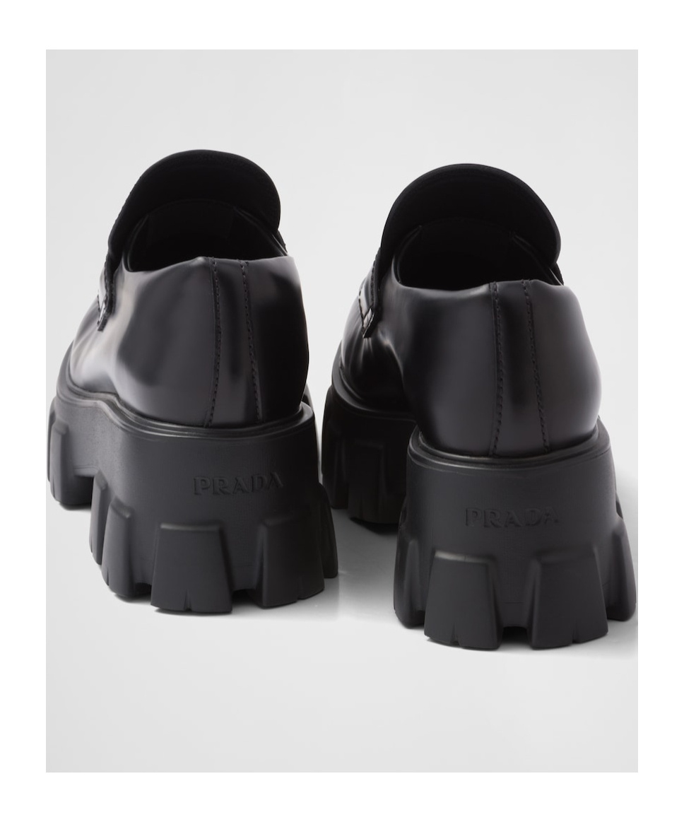 Shop Prada Brushed Leather Monolith Loafers In Black