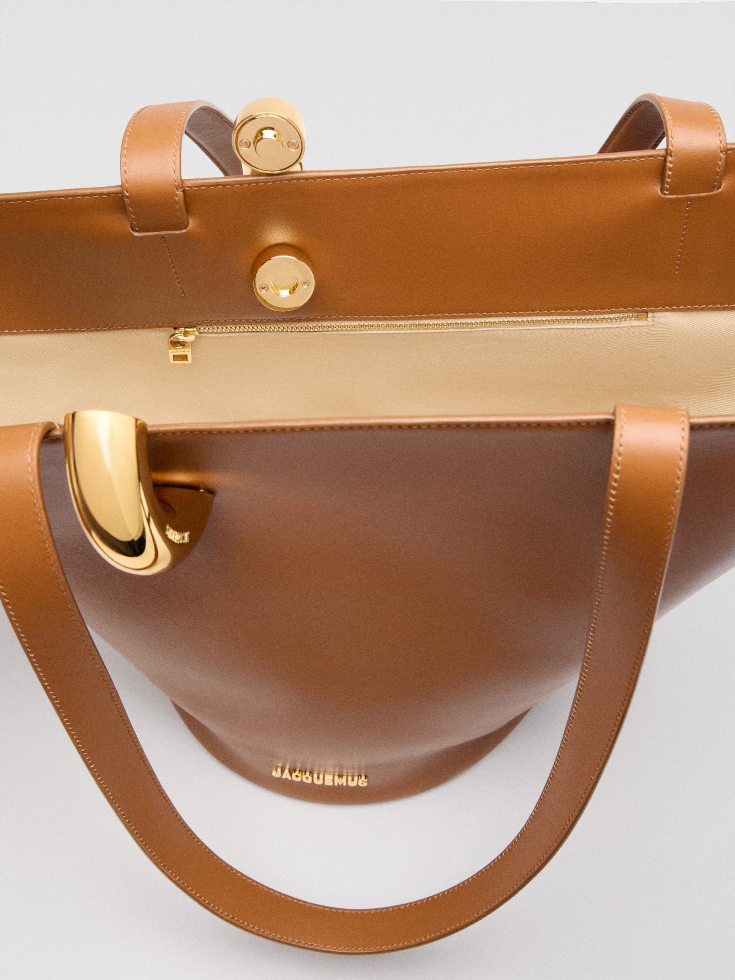 Jacquemus The Medium Bambola Asymmetric Leather Bucket Bag In Brown