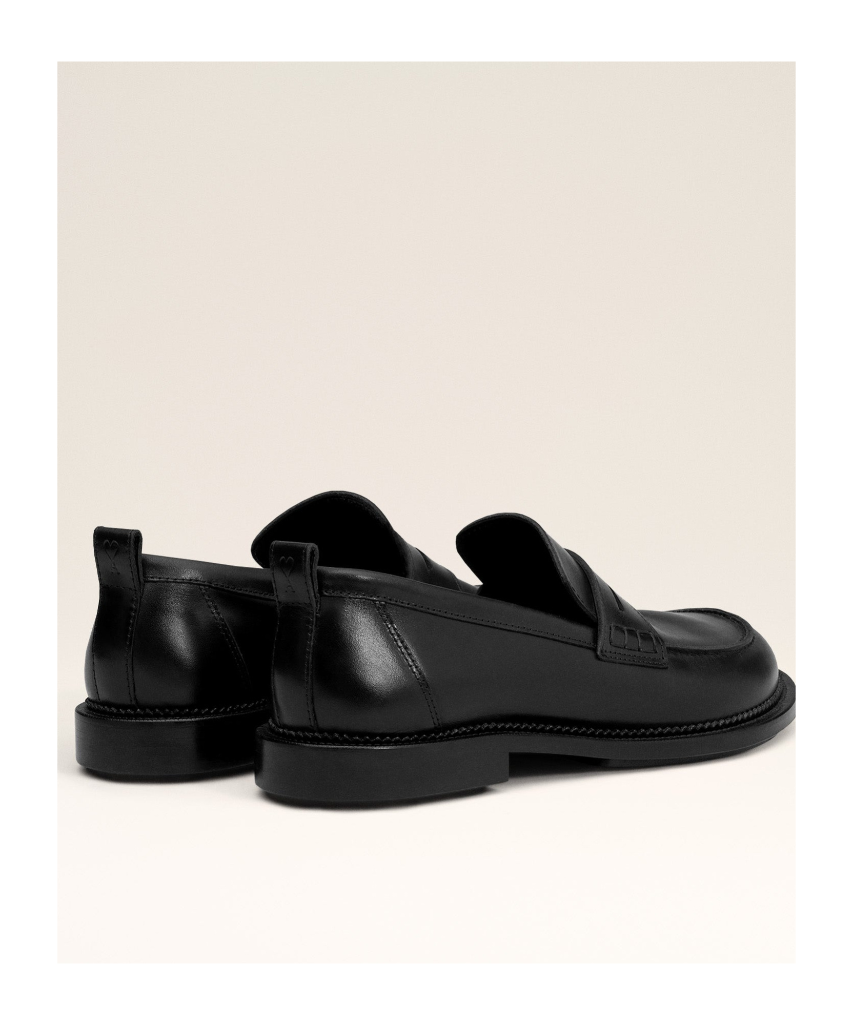 AMI ALEXANDRE MATTIUSSI AMI LOGO EMBOSSED SLIP-ON LOAFERS