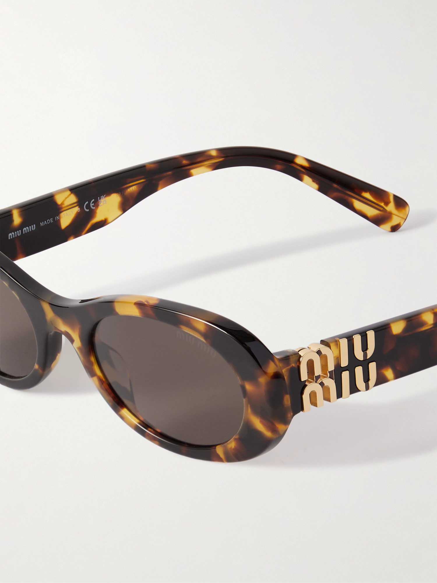 Shop Miu Miu Logo Sunglasses In Black