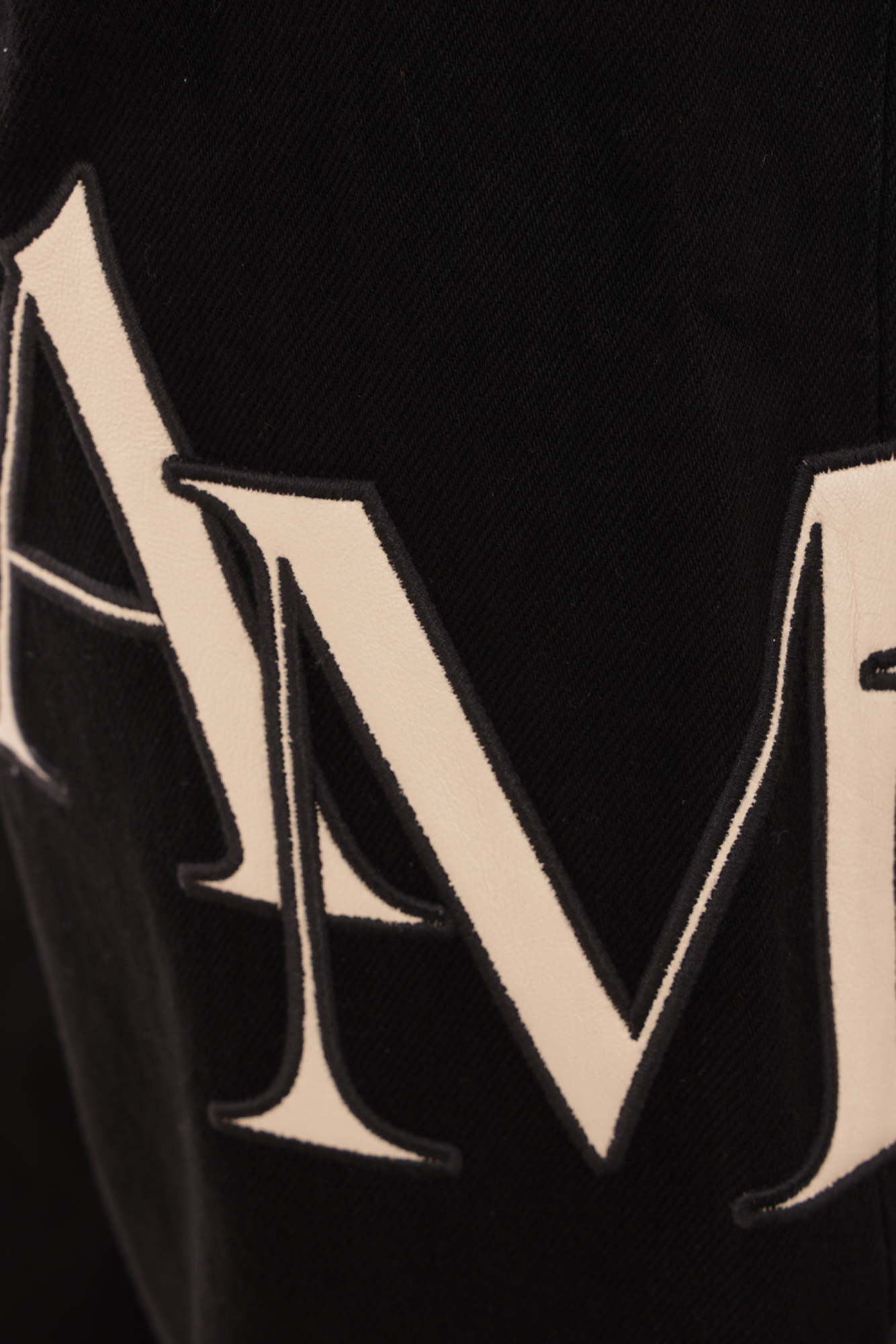 Amiri Staggered Logo Jeans In Black