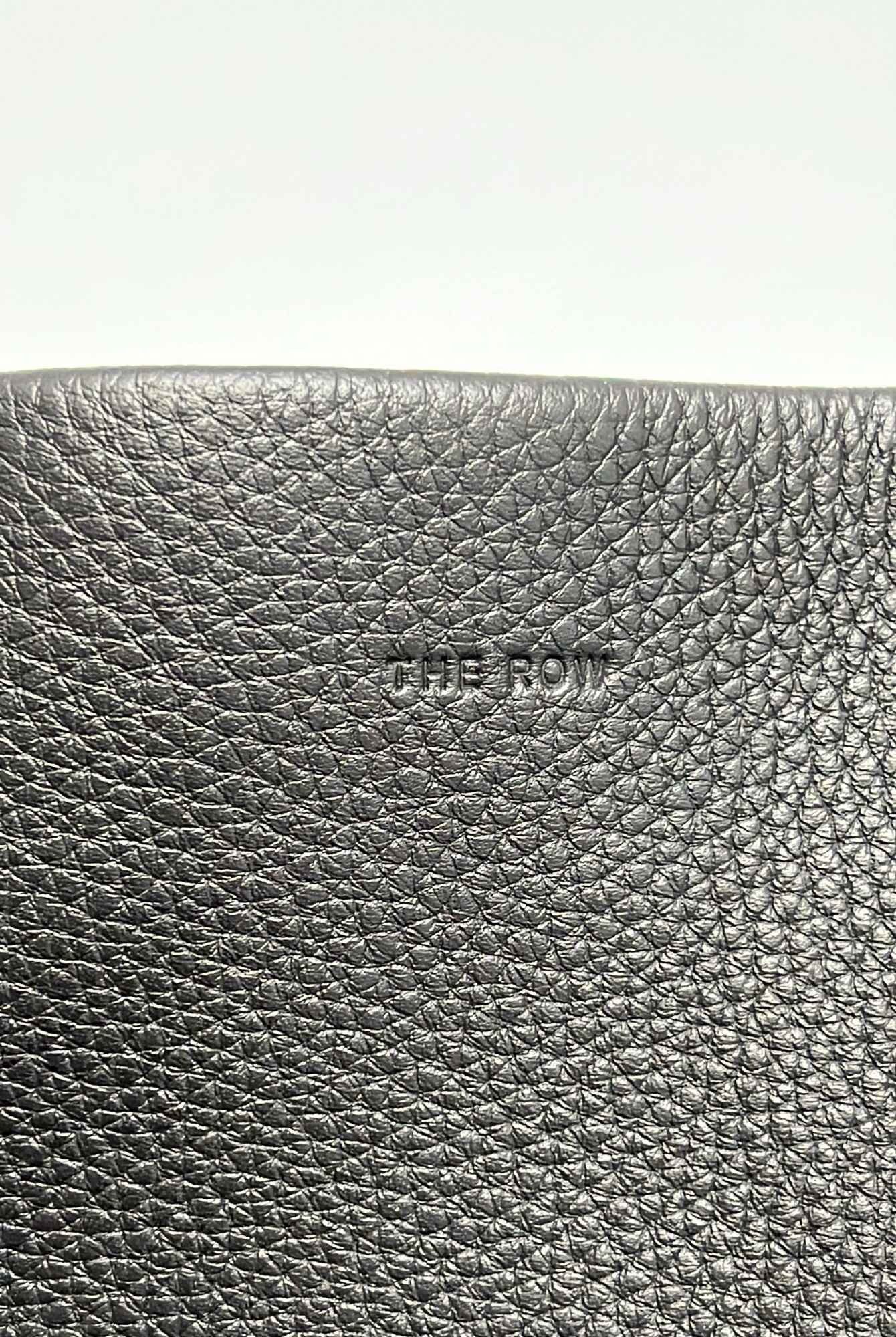 The Row Embossed-logo Detail Tote Bag In Black