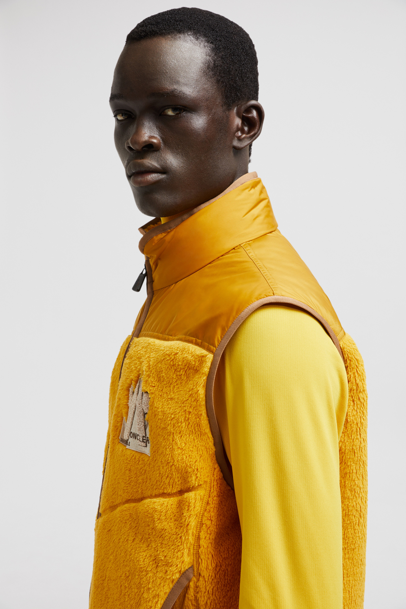 Moncler Logo Embroidered Down Vest In Yellow