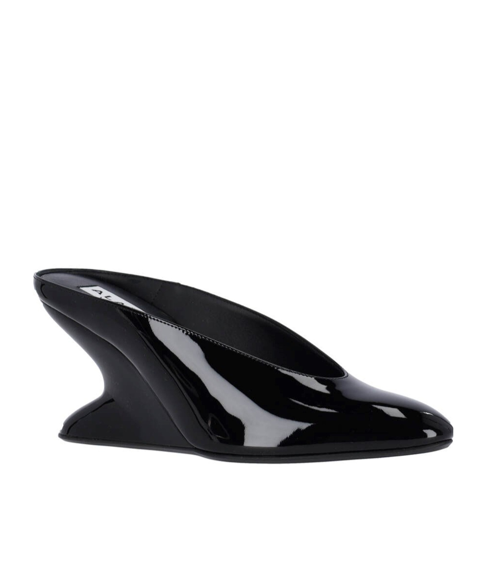 Shop Alaïa Mules With Curved Wedges In Black