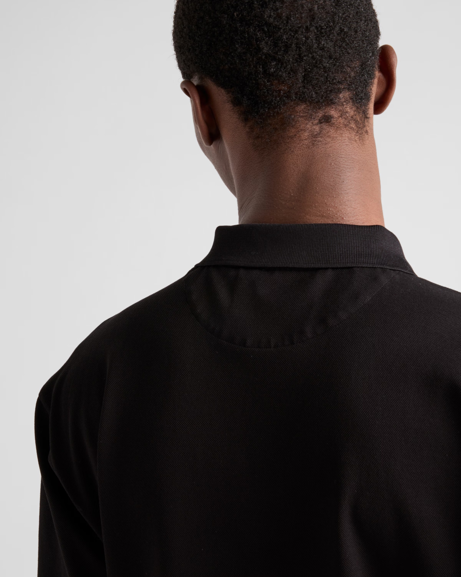 PRADA PIQUÉ POLO SHIRT WITH RE-NYLON DETAILS