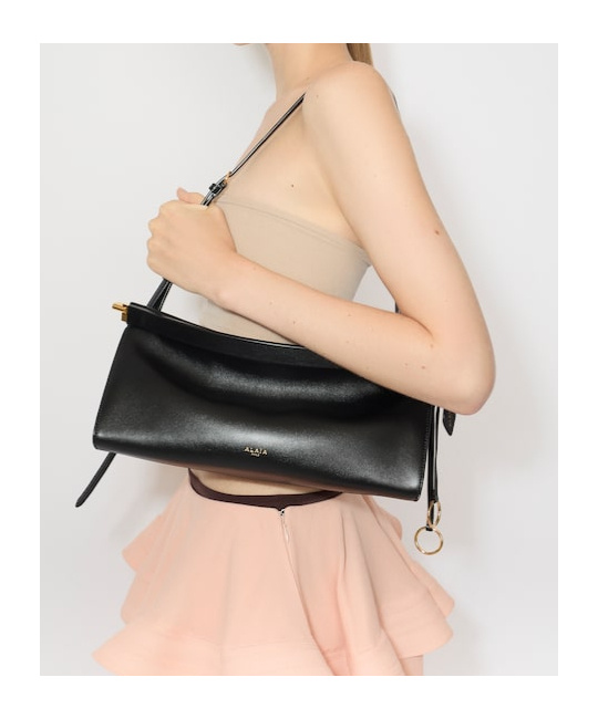 Shop Alaïa Small Le Click East West Shoulder Bag In Black