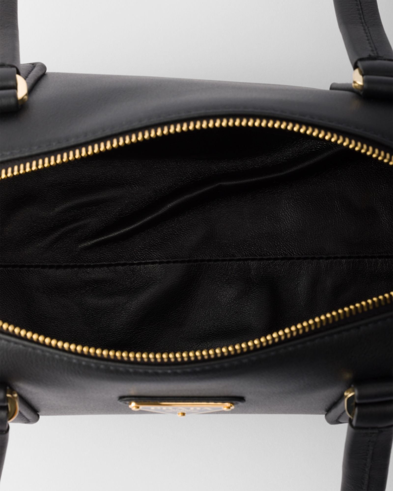 Prada Women Re-nylon And Leather Medium Top-handle Bag With Padlock In Black