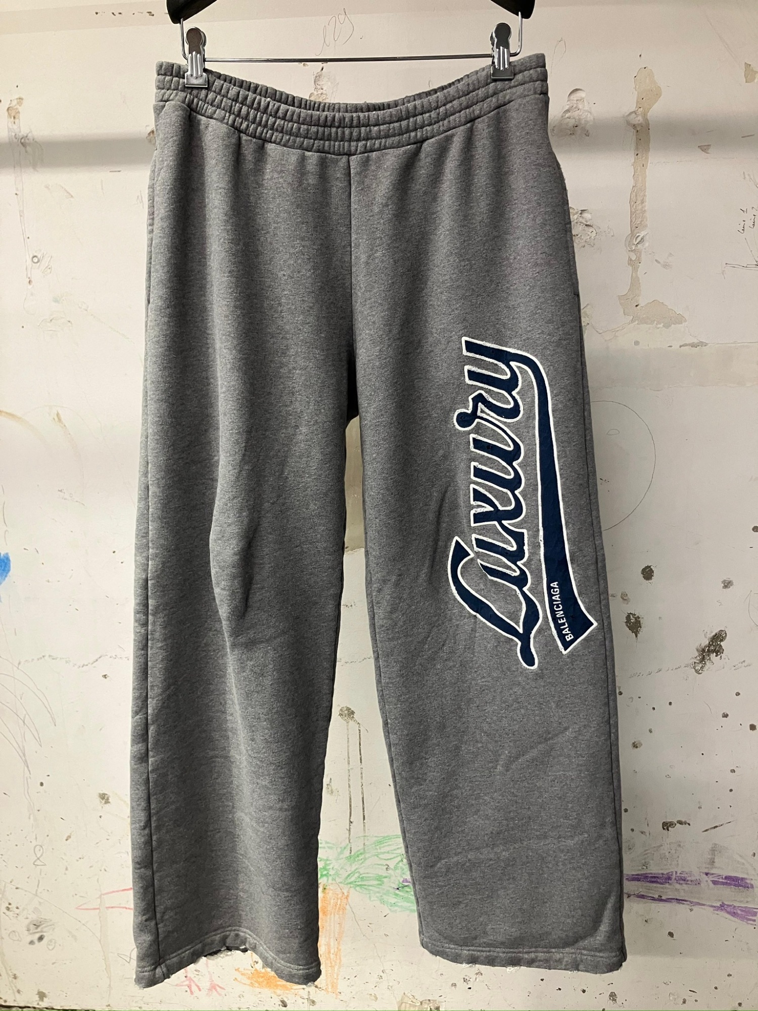 Balenciaga Luxury Script Loose Track Pants In Gray