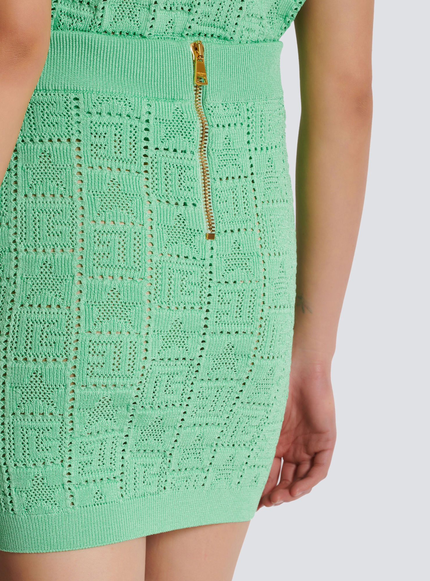 Balmain Monogram-pattern Open-knit Miniskirt In Green