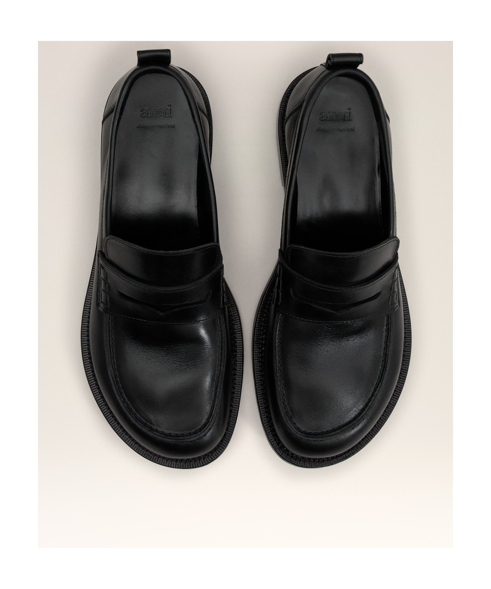 AMI ALEXANDRE MATTIUSSI AMI LOGO EMBOSSED SLIP-ON LOAFERS