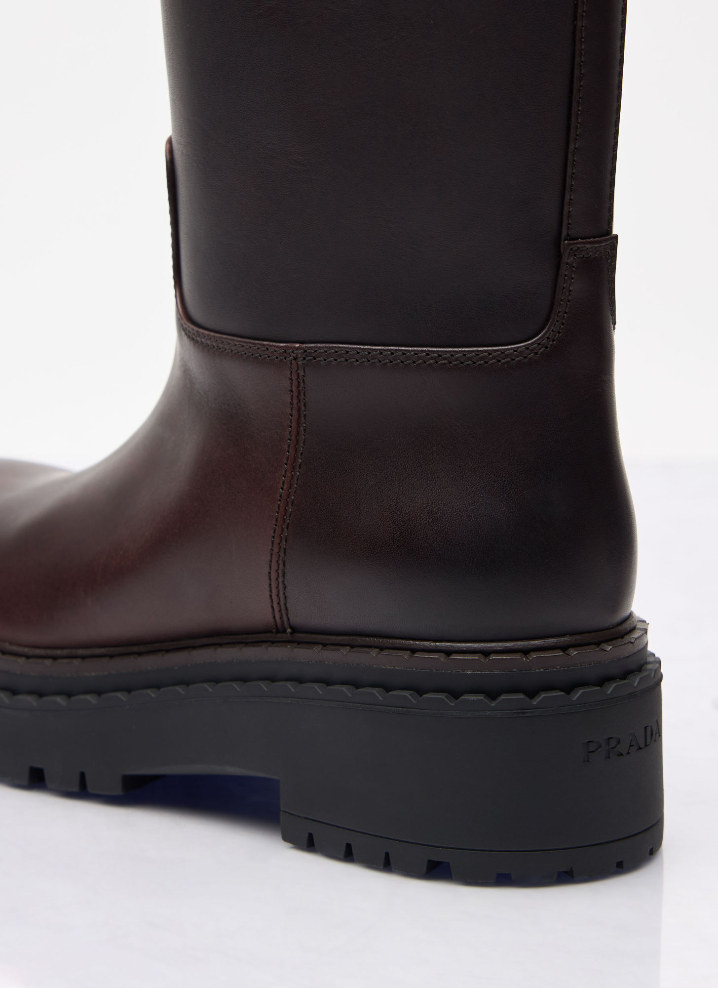 Prada Women Logo Plaque Leather Boots In Black