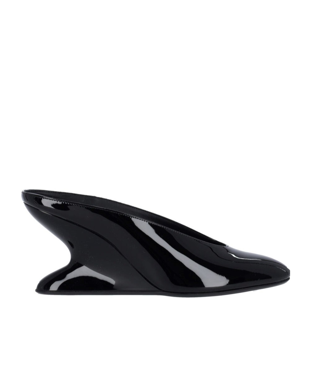 ALAÏA MULES WITH CURVED WEDGES