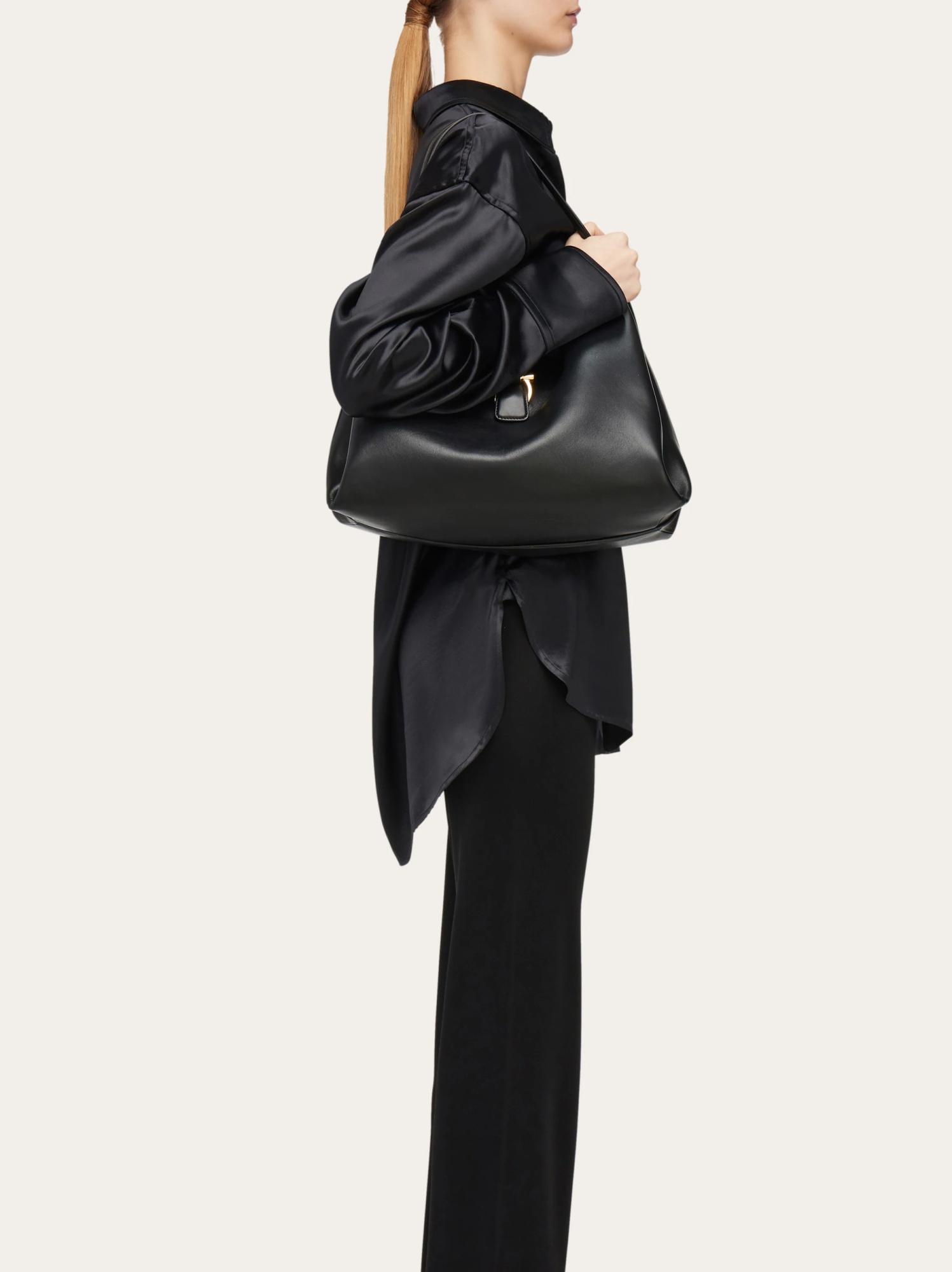 Ferragamo Buckle Strap Soft Structure Shoulder Bag In Black