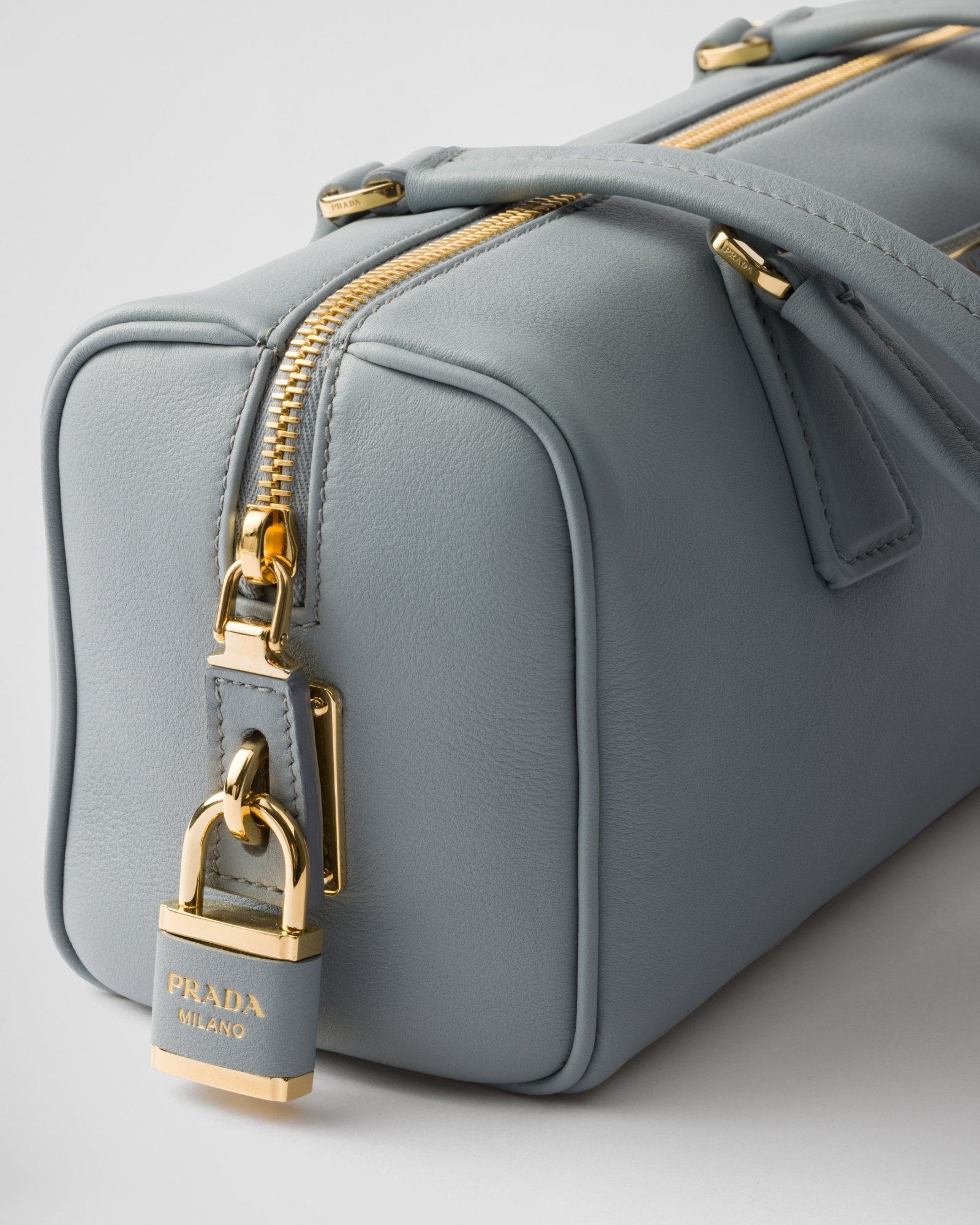 Shop Prada Medium Leather Top-handle Bag With Padlock In Gray