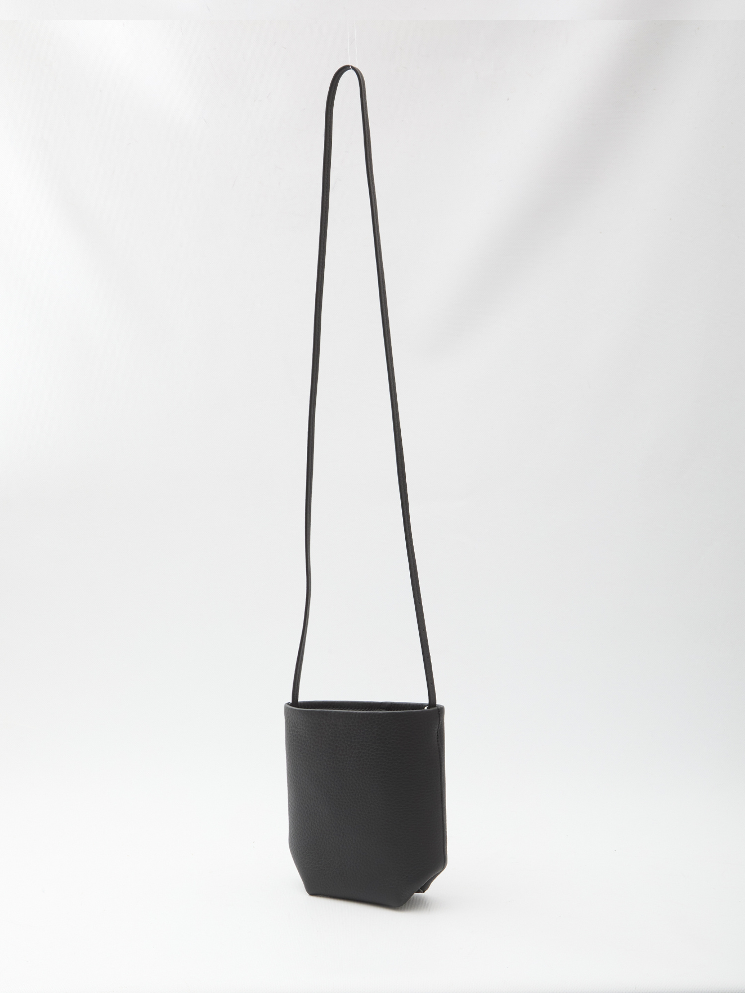 The Row Crossbody Bag Featuring Adjustable Strap In Black
