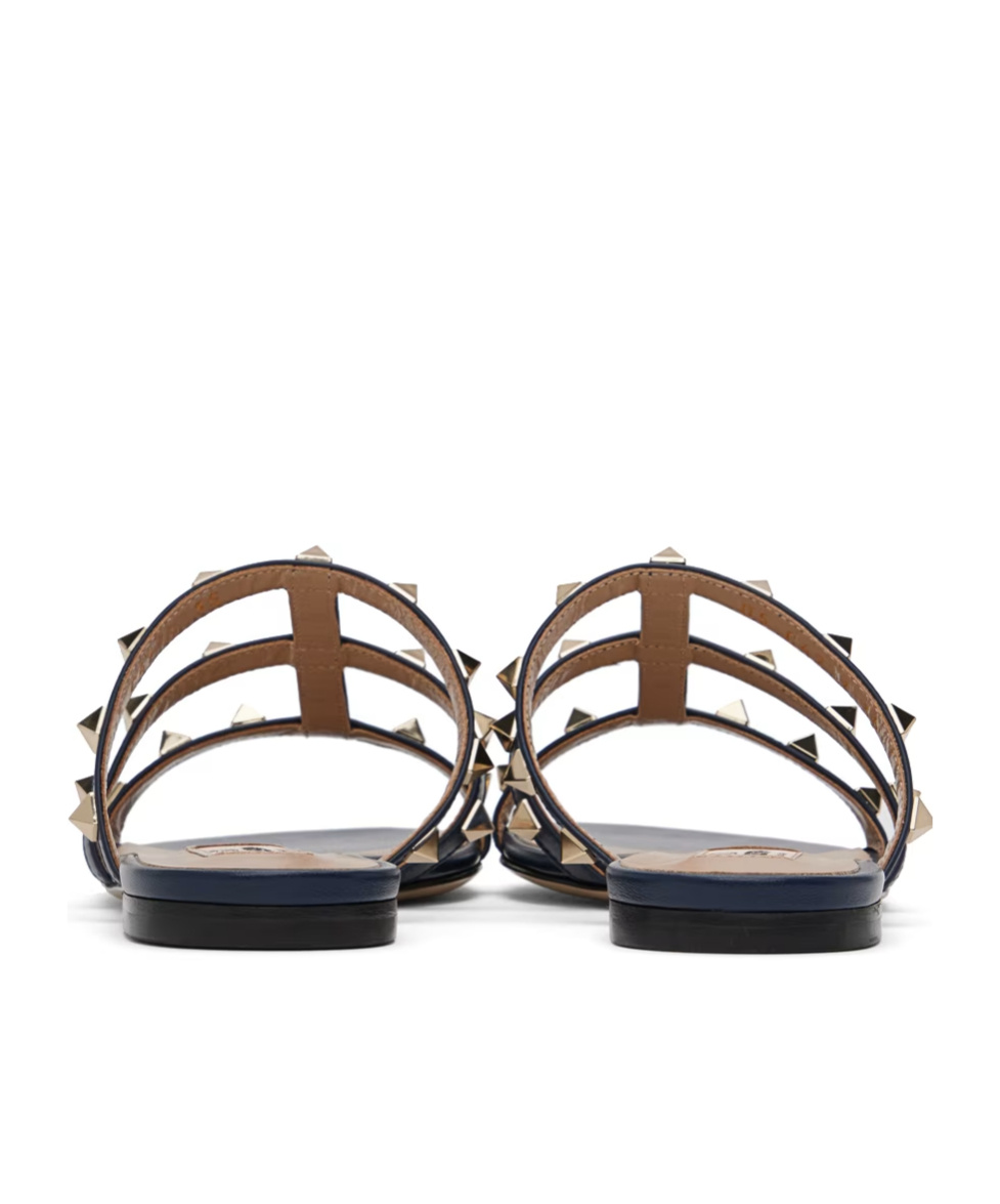 Shop Valentino Rockstud Flat Sandals In Black