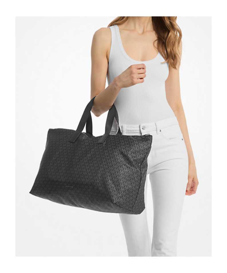 Michael Kors Michael Tanner Large Printed Signature Logo Reversible Packable Tote Bag In Black