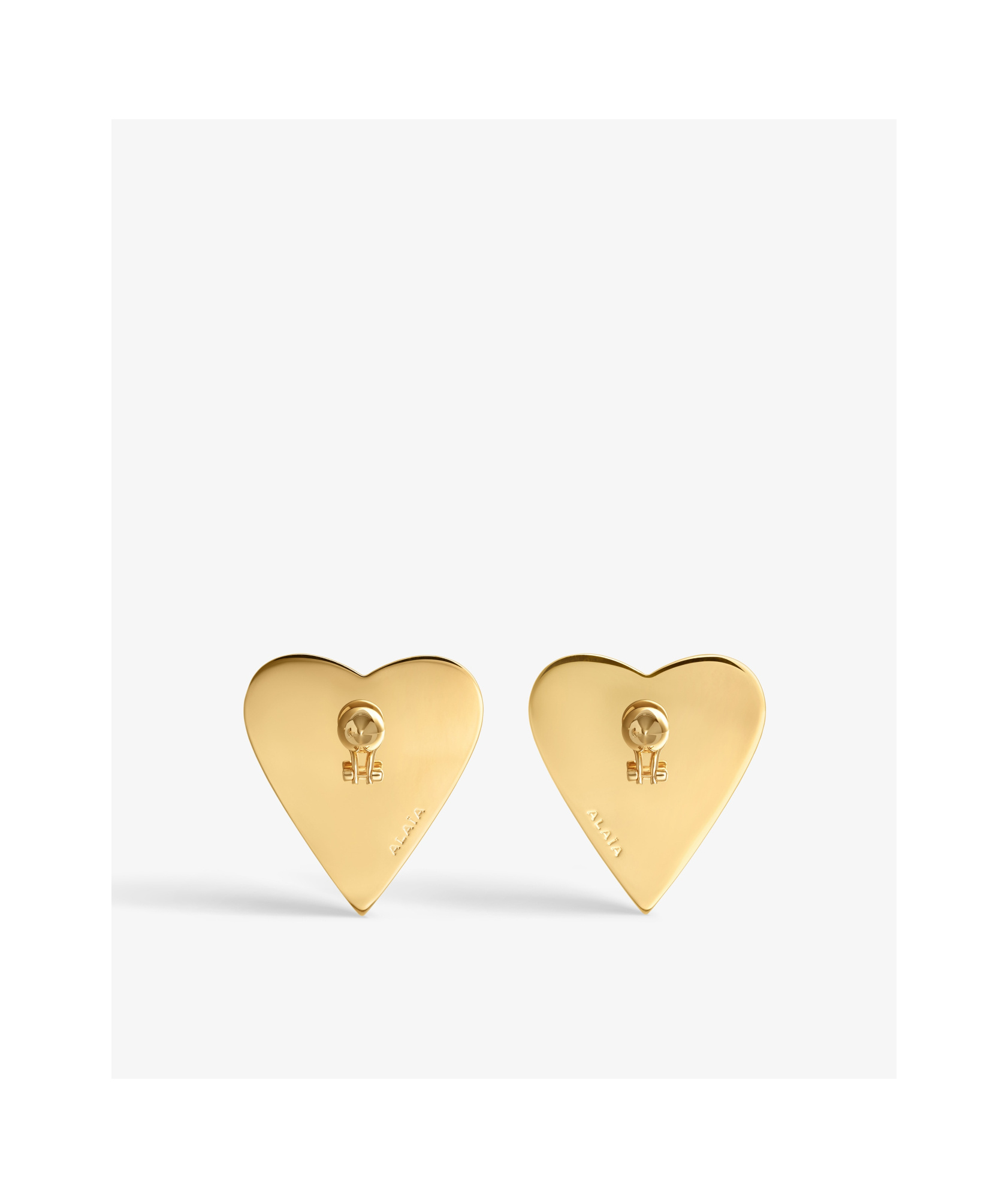 Alaïa Bombe Heart Embellished Earrings In White