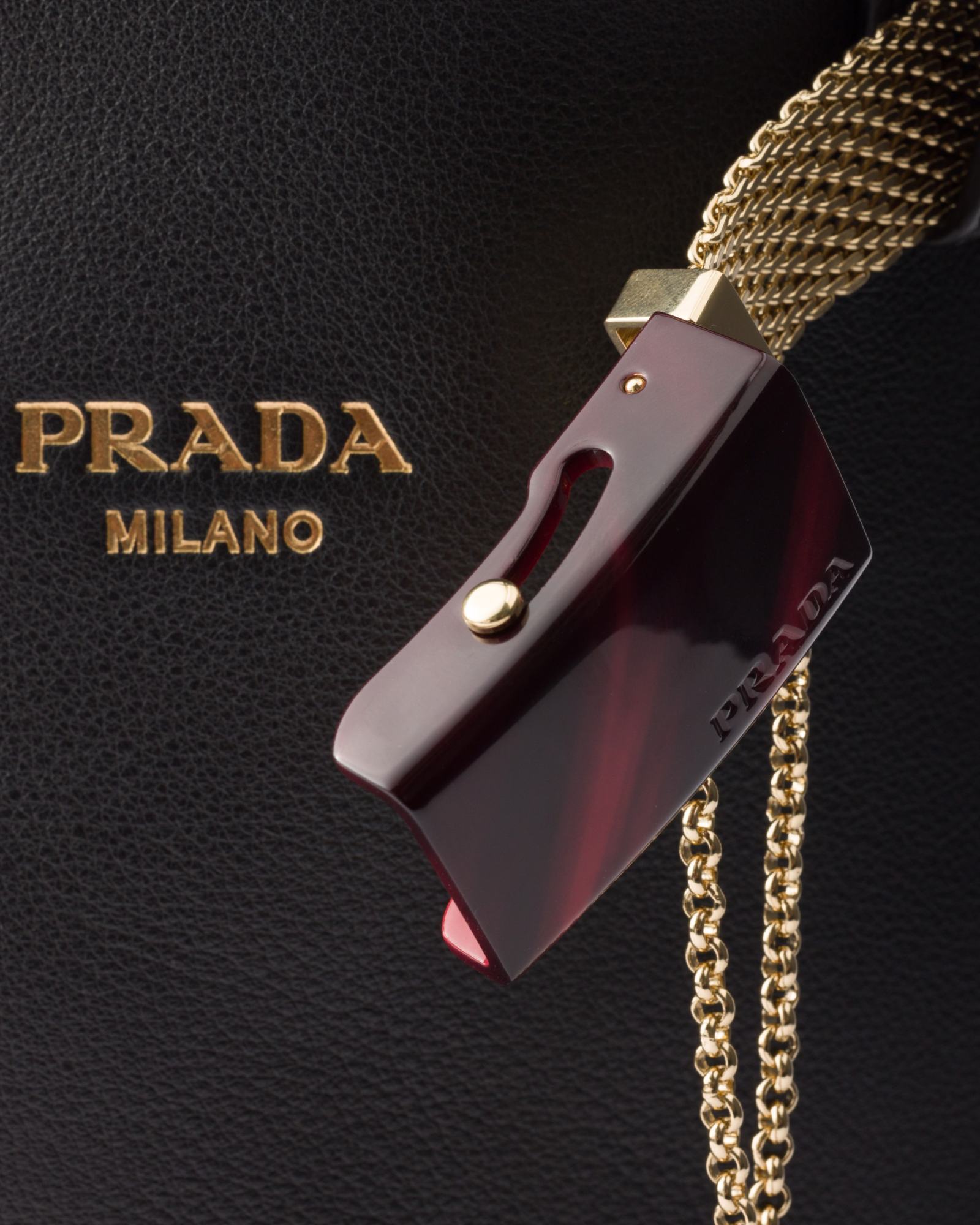 Prada Buckle Leather Bucket Bag With Jeweled Belt In Black