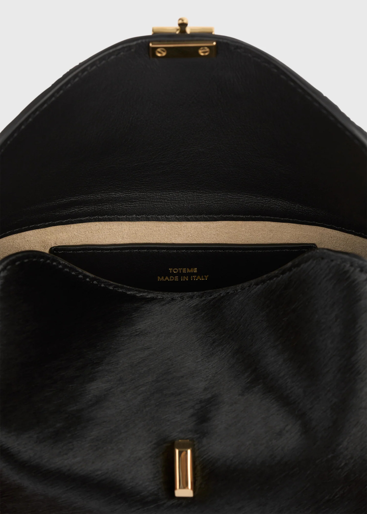 Totême Pony Hair T-lock Clutch In Black