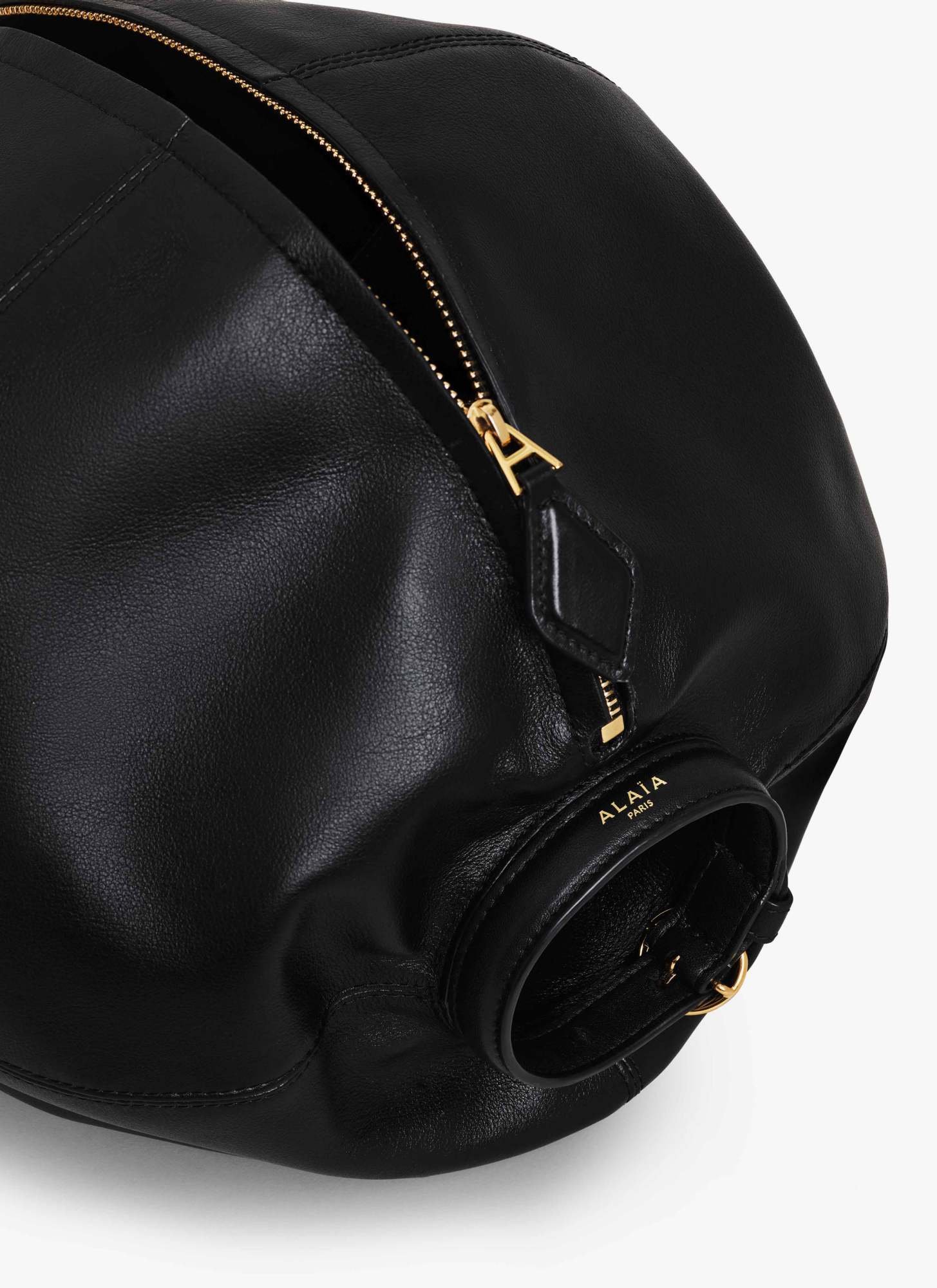 Alaïa Paneled Polished Leather Clutch In Black