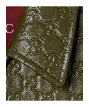 Gucci Embossed Gg Leather Bomber Jacket In Green