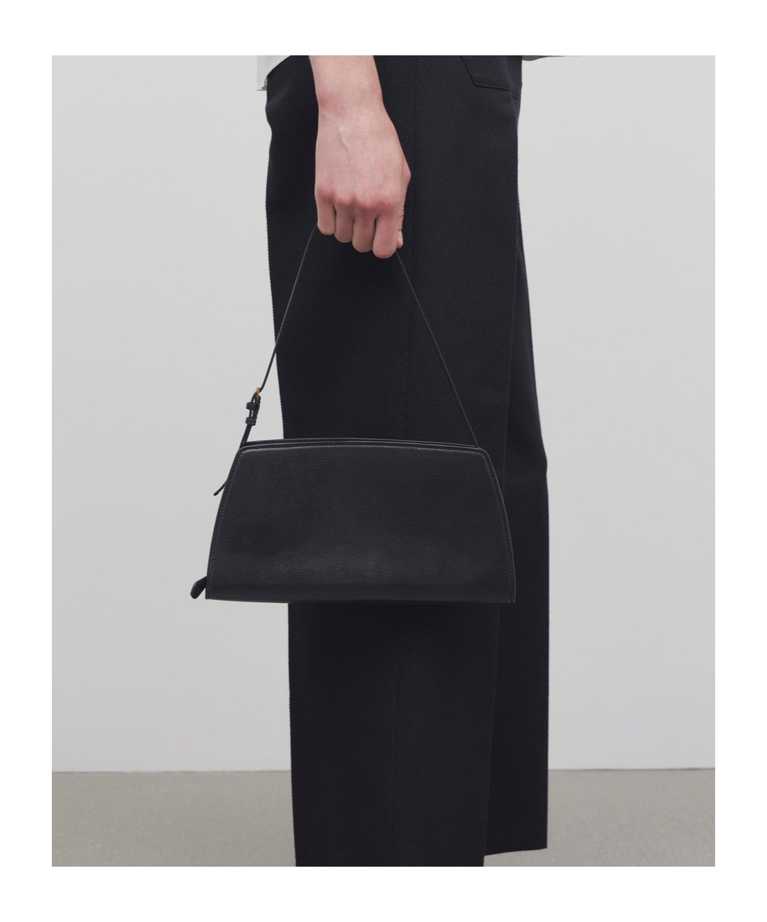 The Row Dalia Baguette Logo Shoulder Bag In Black