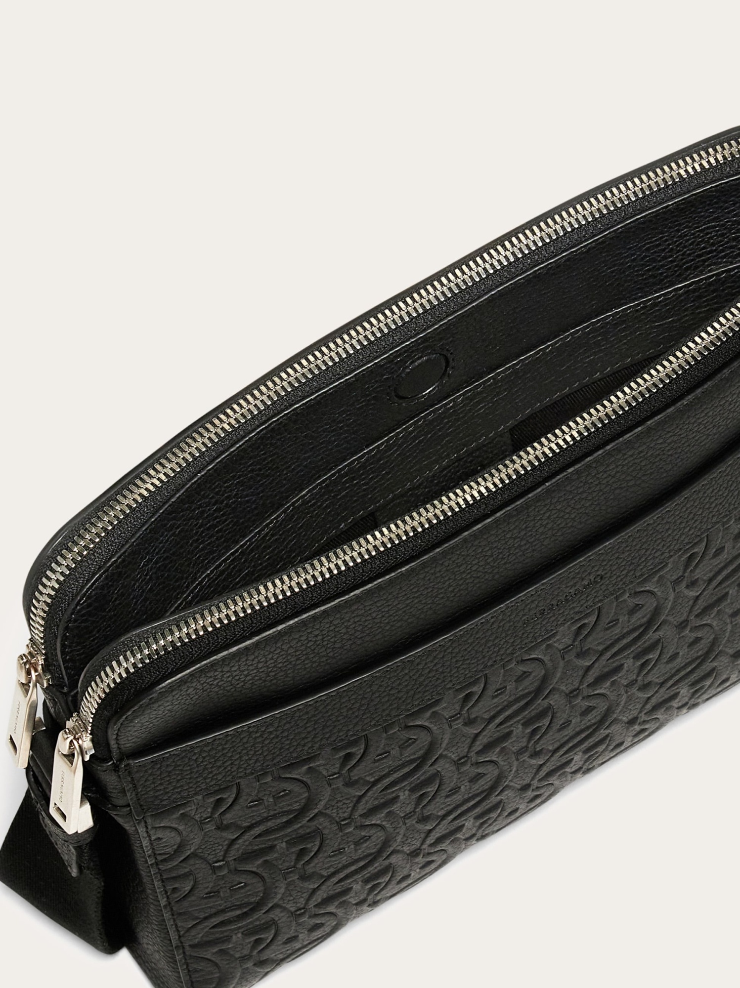 Shop Ferragamo Logo Embossed Shoulder Bag In Black