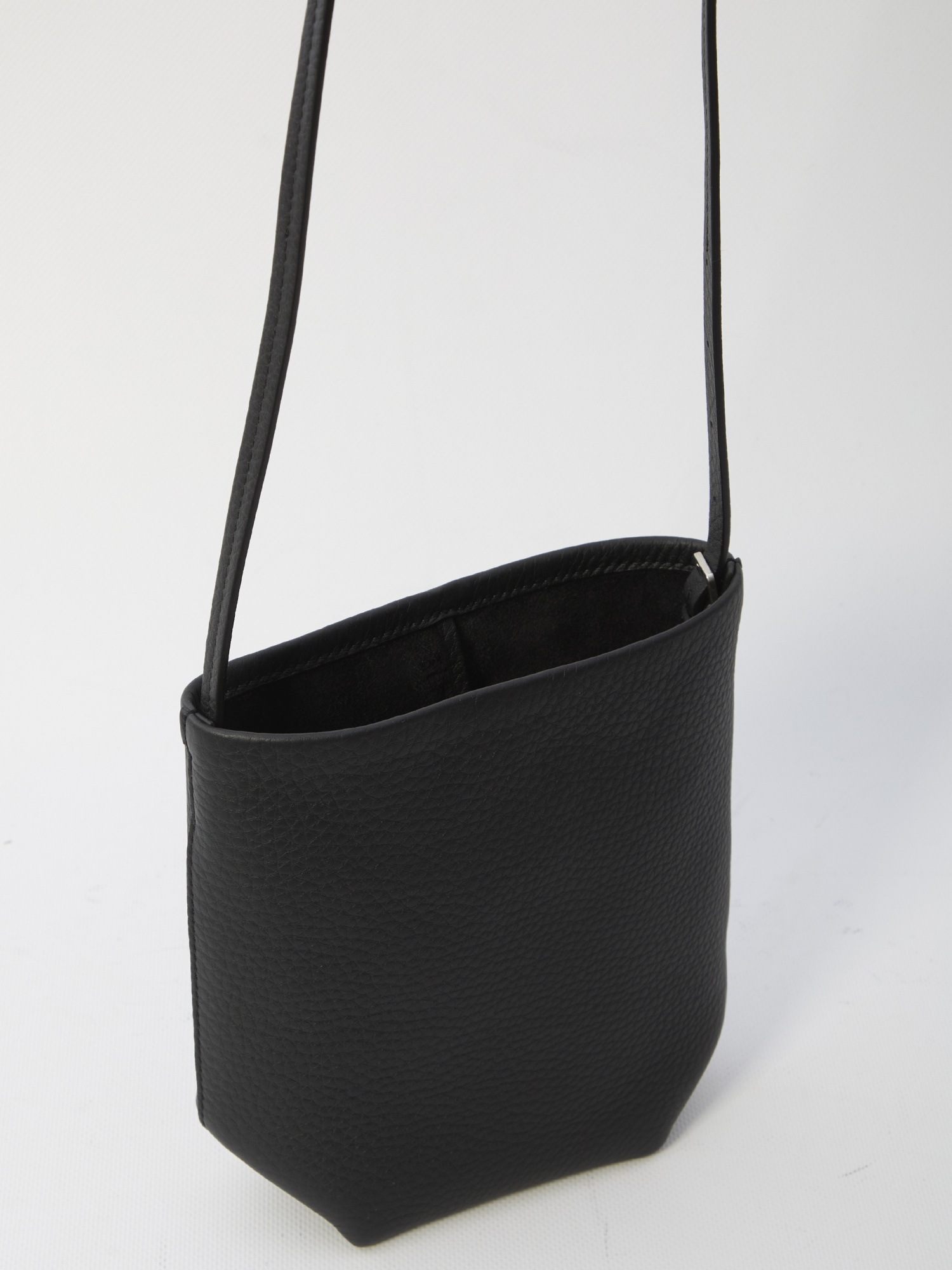 The Row Crossbody Bag Featuring Adjustable Strap In Black