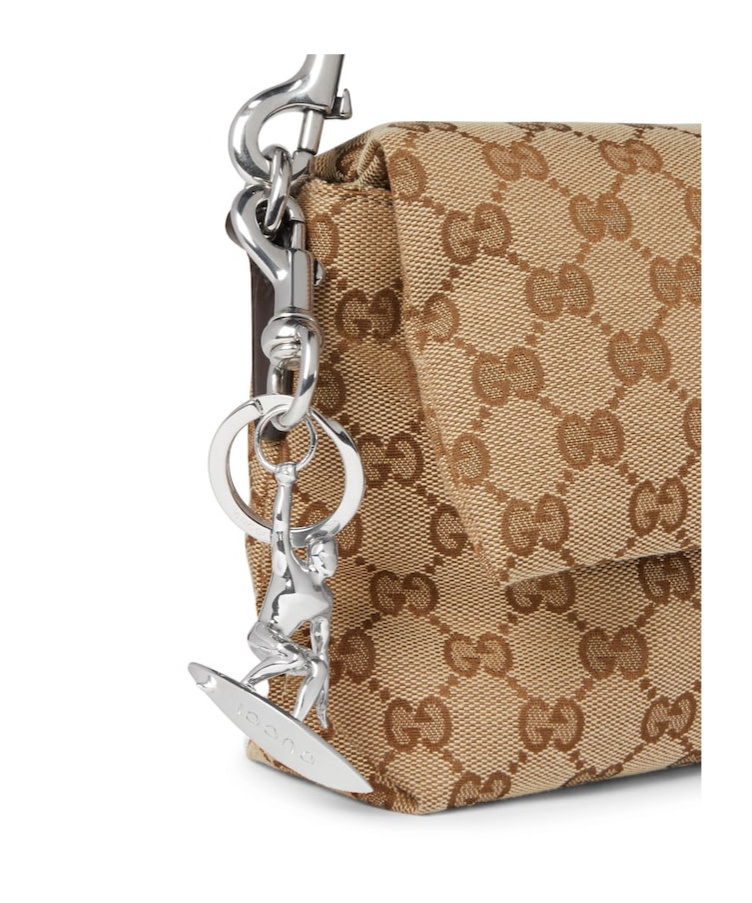 Gucci Engraved Surfer Keychain Charm In Silver