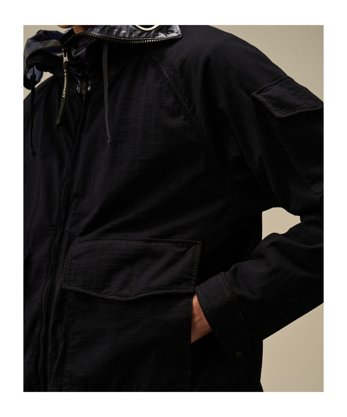 C.p. Company Blue Jacket With Explorer Hood And Adjustable Drawstring Waist In Tech Fabric Man In Black