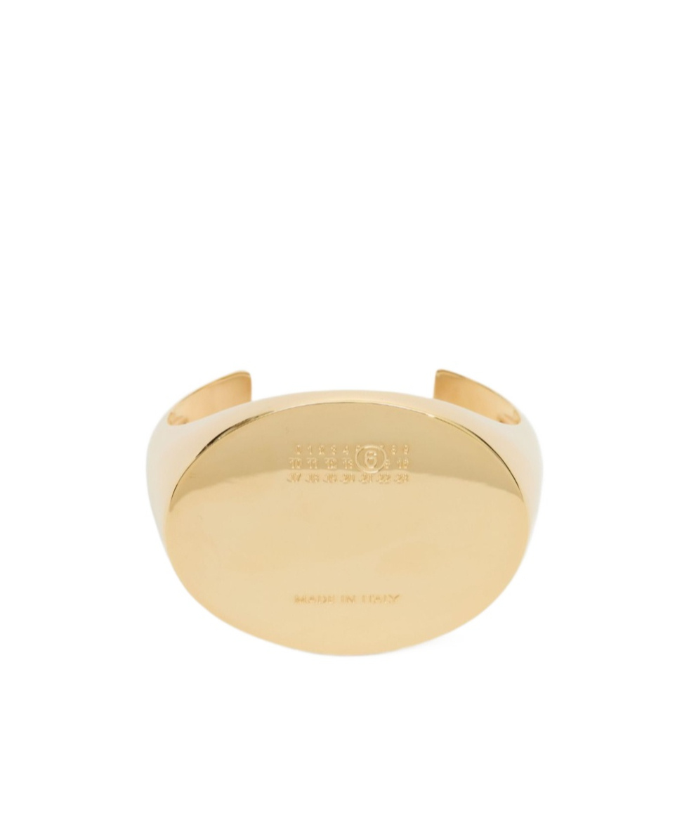 Mm6 Maison Margiela Logo-engraved Cuff Bracelet In Gold