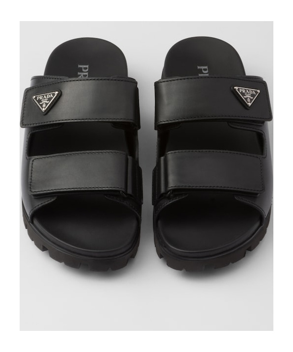 Prada Men Logo Plaque Leather Slides In Black