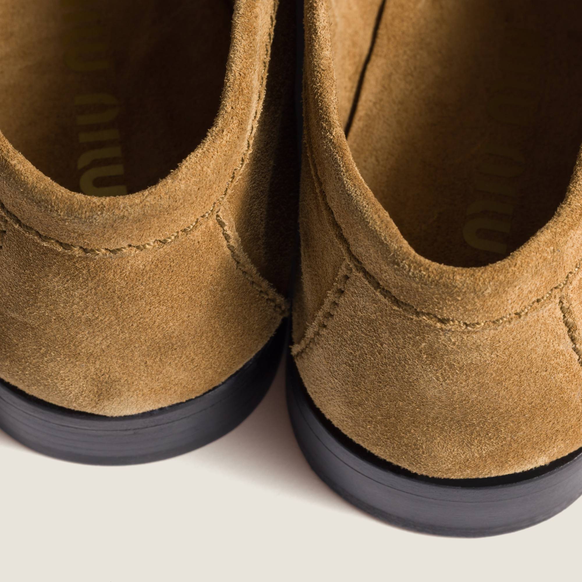 Miu Miu Embossed-logo Suede Loafers In Brown