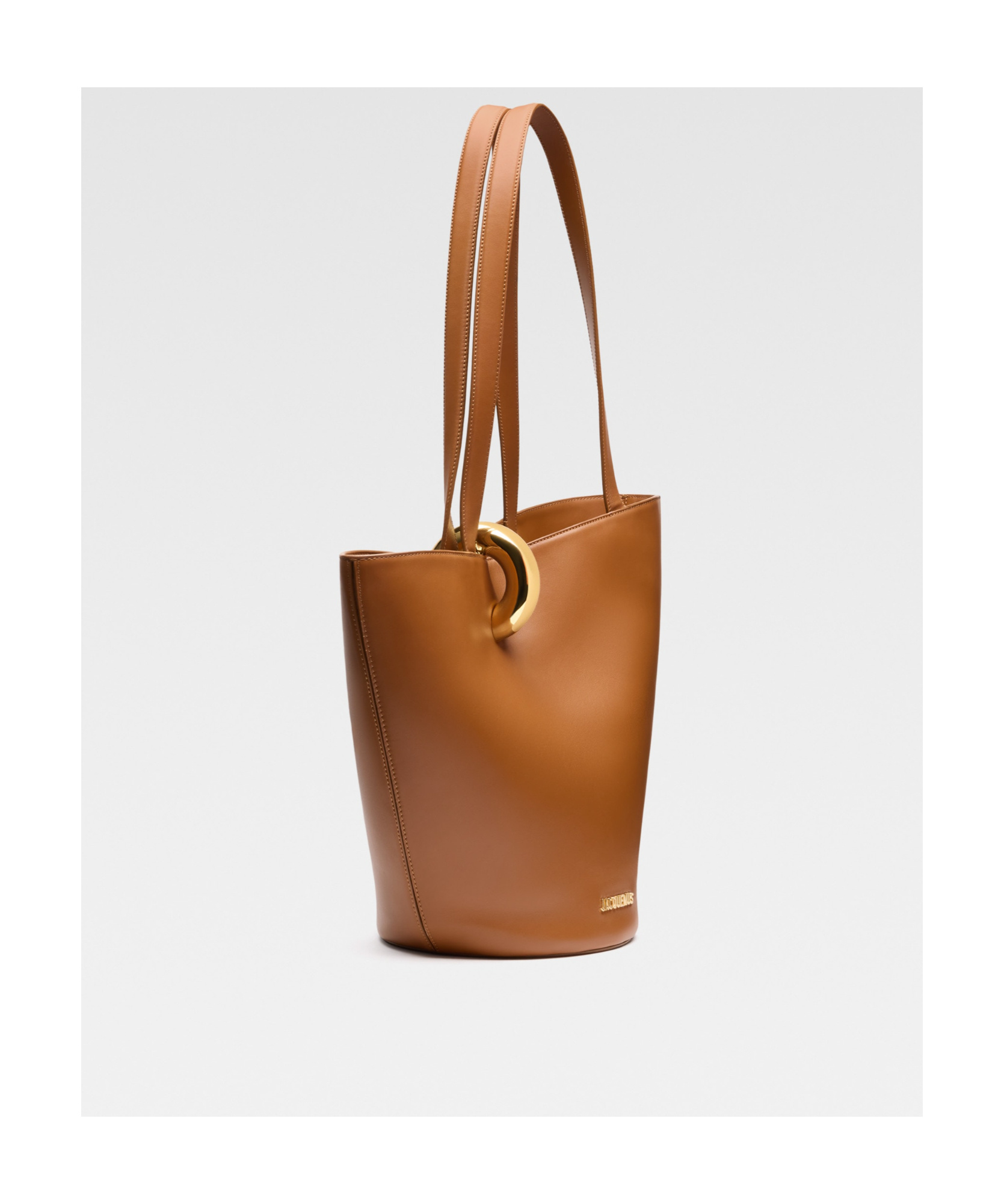 Jacquemus The Medium Bambola Asymmetric Leather Bucket Bag In Brown