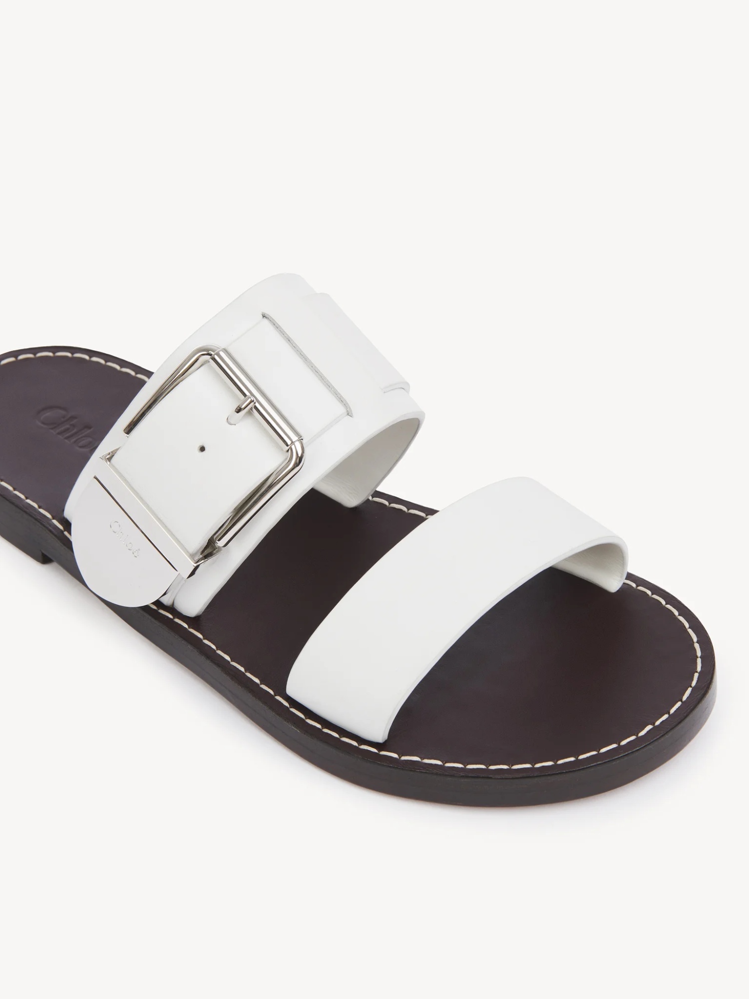 Chloé Rebecca Slides In White