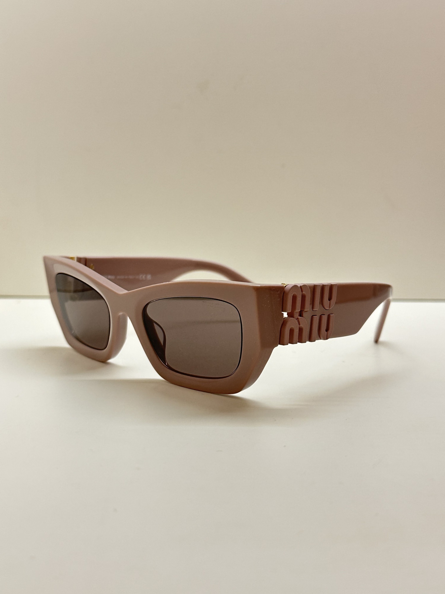 Miu Miu Logo-plaque Rectangular Sunglasses In Pink