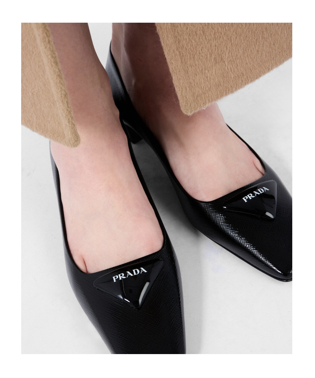 Prada Triangle Saffiano Patent Pump In Black
