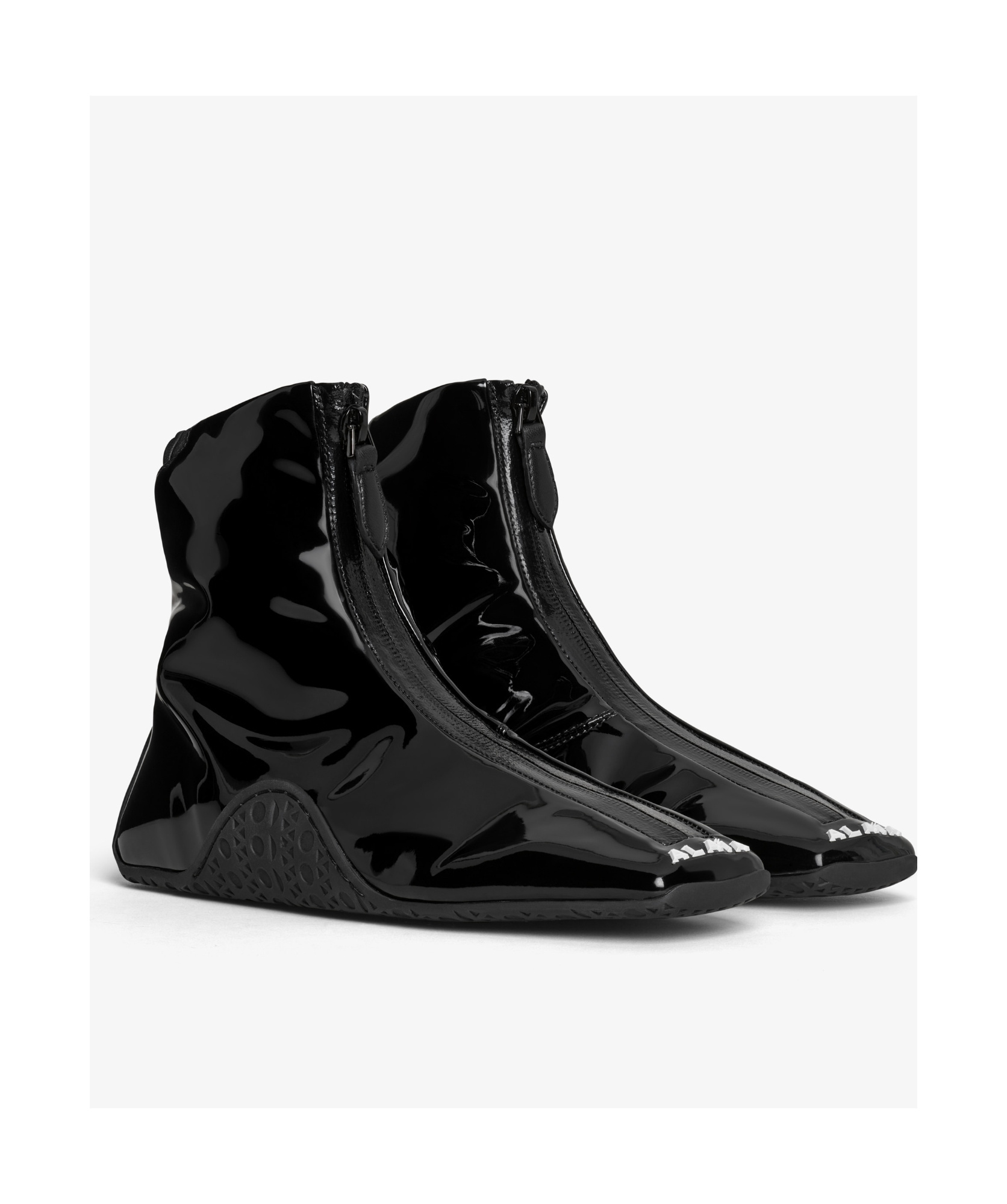 Shop Alaïa Logo-embossed Sneakers In Black