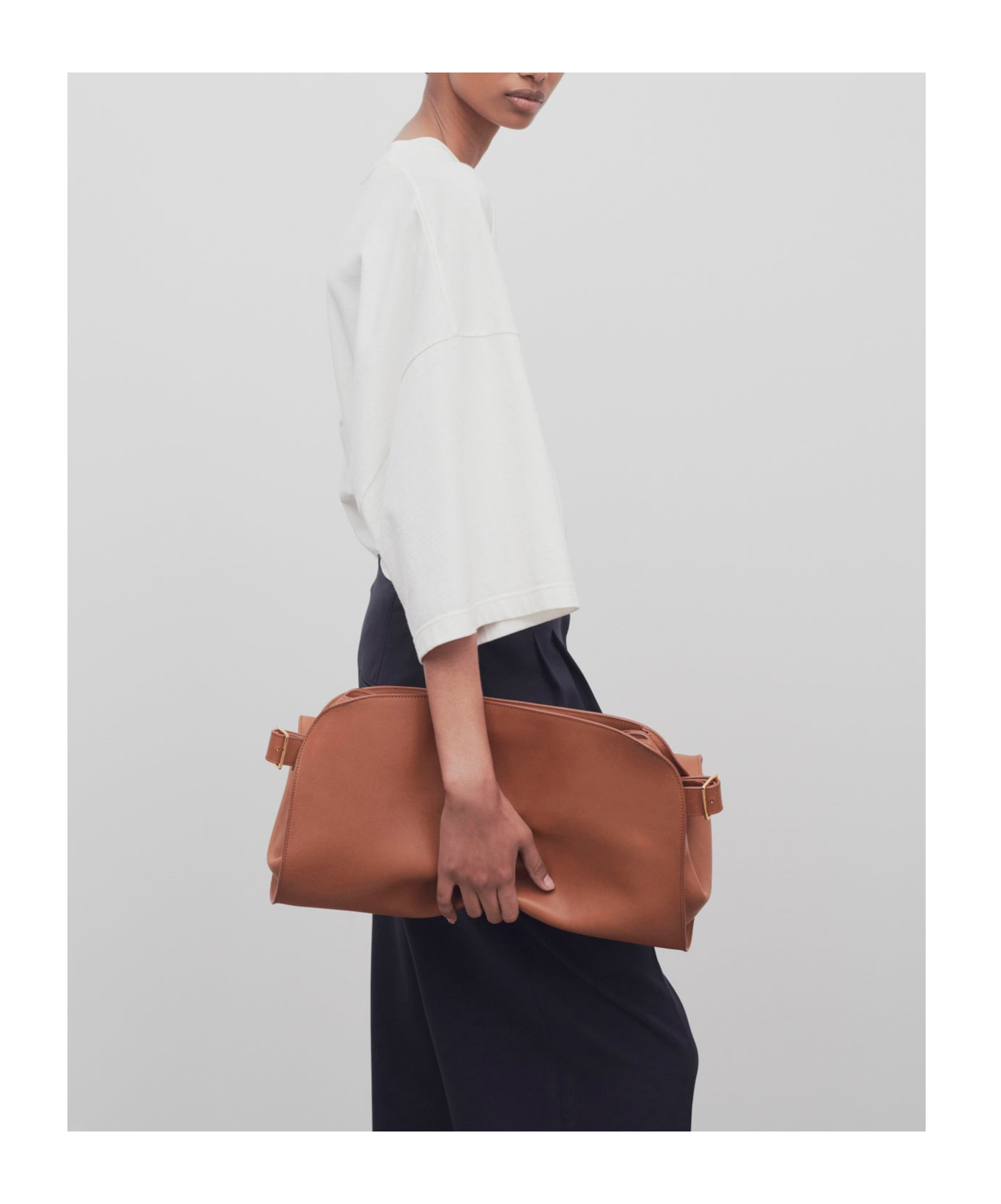 The Row Margaux Ew Clutch Logo Clutch In Brown