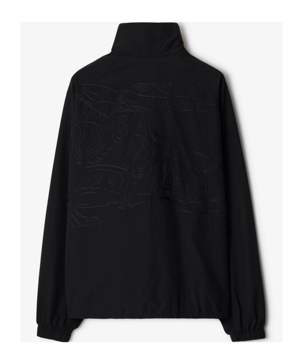 Burberry Logo Embossed Drawstring Jacket In Black