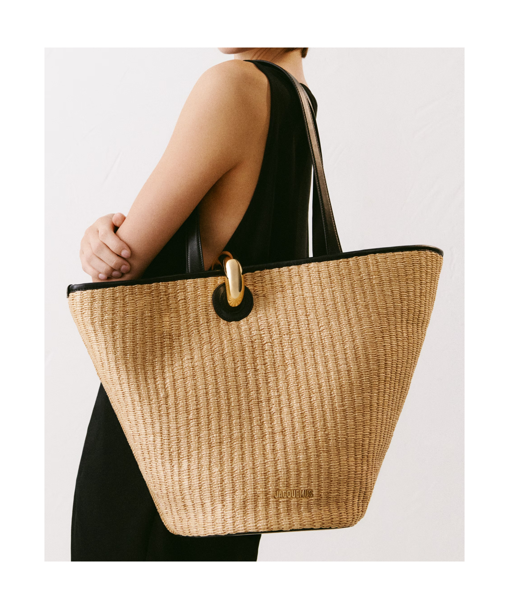 Jacquemus The Bambola Asymmetric Bucket Bag In Nude