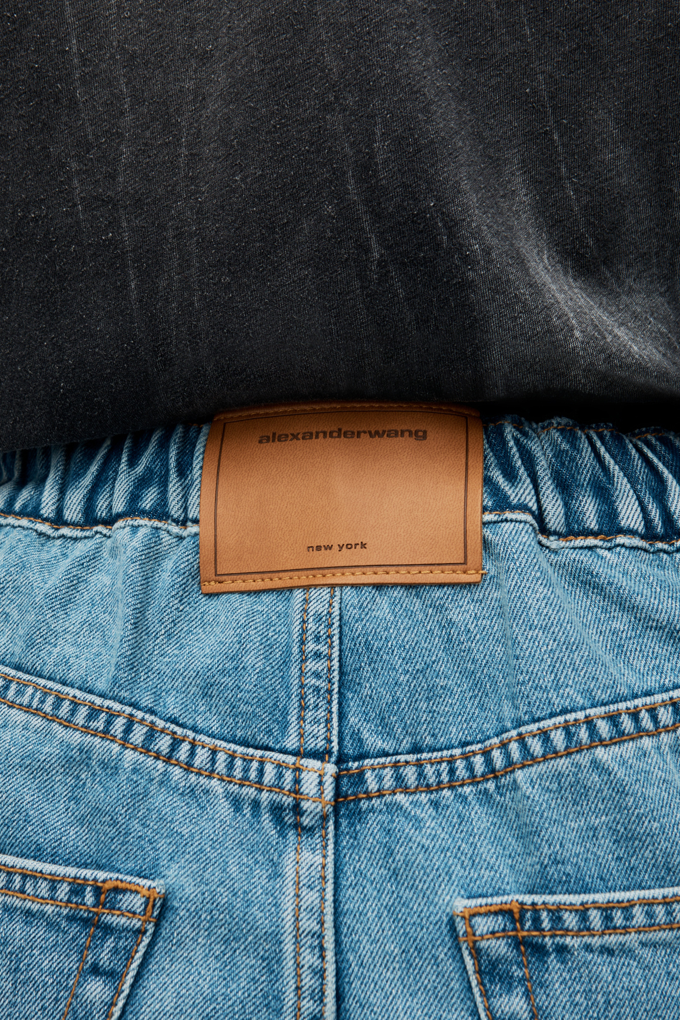 ALEXANDER WANG LOGO-EMBOSSED BOYFRIEND JEANS